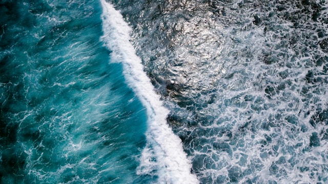 Surfer riding a wave at Cokes